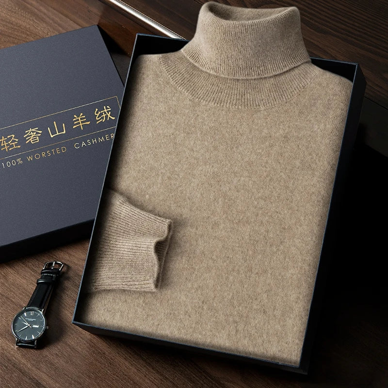Folded beige turtleneck sweater in a box with a watch on a wooden surface