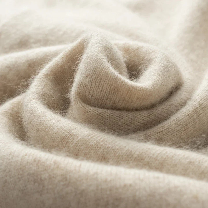 Close-up of beige knitted fabric texture