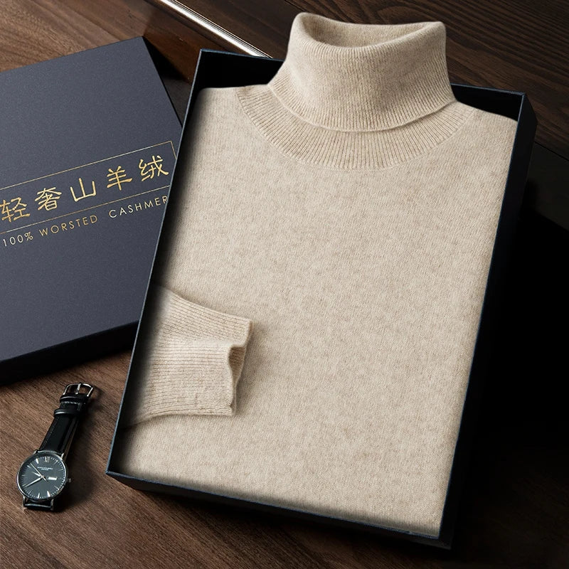 Beige turtleneck sweater in a box with a watch on a wooden surface