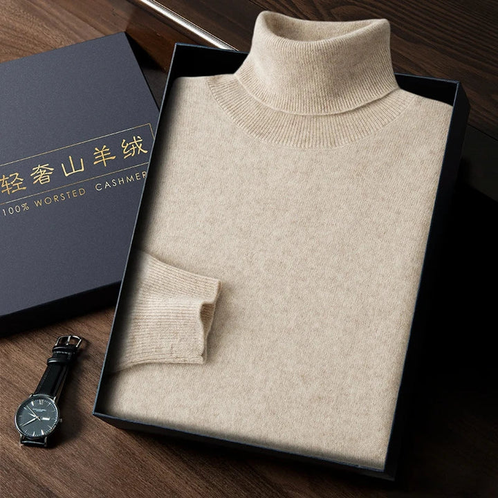 Beige turtleneck sweater in a box with a watch on a wooden surface