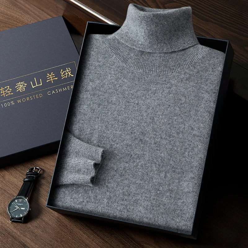 Gray turtleneck sweater in a box with a watch on a wooden surface