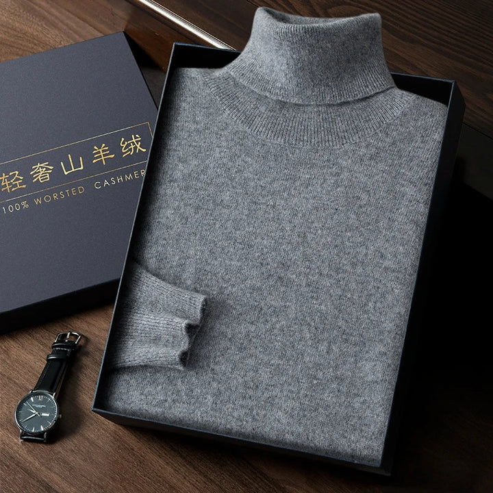 Gray turtleneck sweater in a box with a watch on a wooden surface