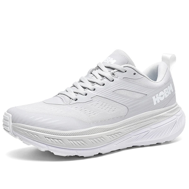 White running shoe with 'HOKA' branding on a white background