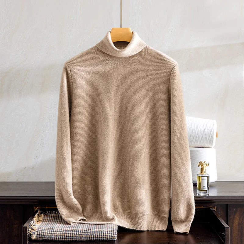 Beige sweater on a hanger against a neutral background