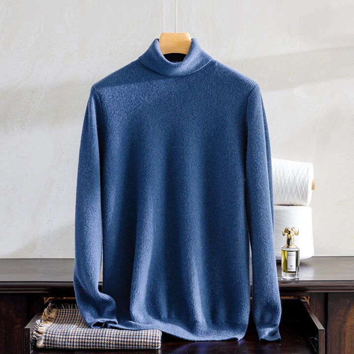 Blue turtleneck sweater on a hanger against a neutral background