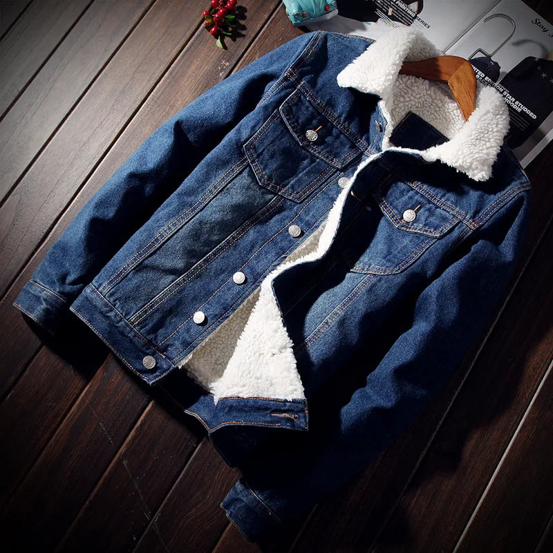 Blue denim jacket with white sherpa lining on a wooden surface