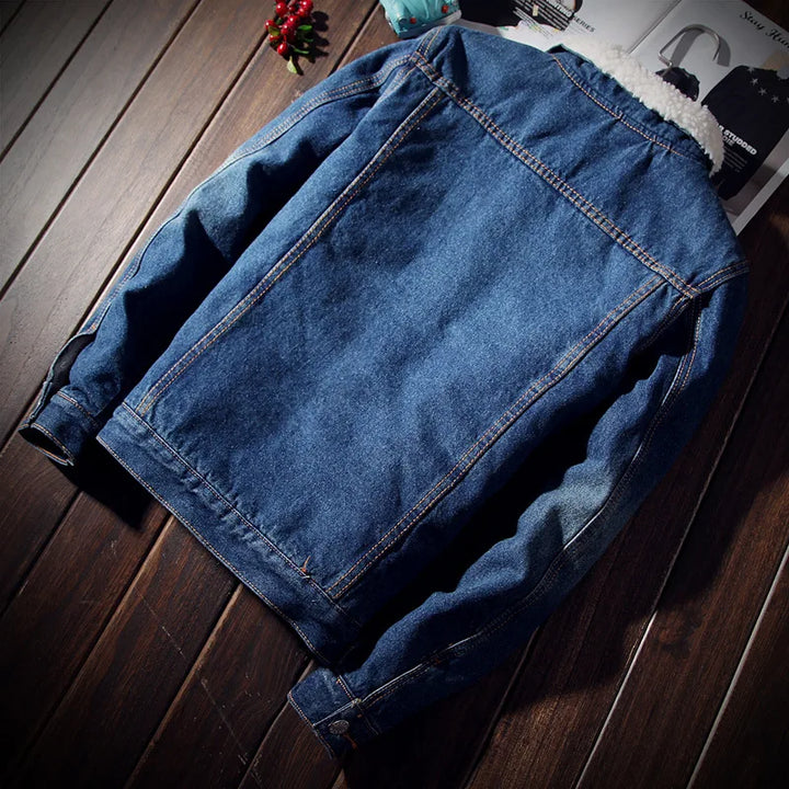 Blue denim jacket on a wooden surface