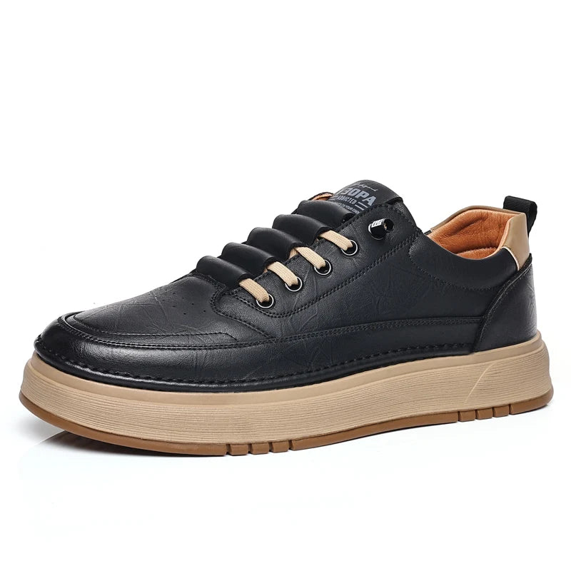 Black leather sneaker with tan sole on a white background