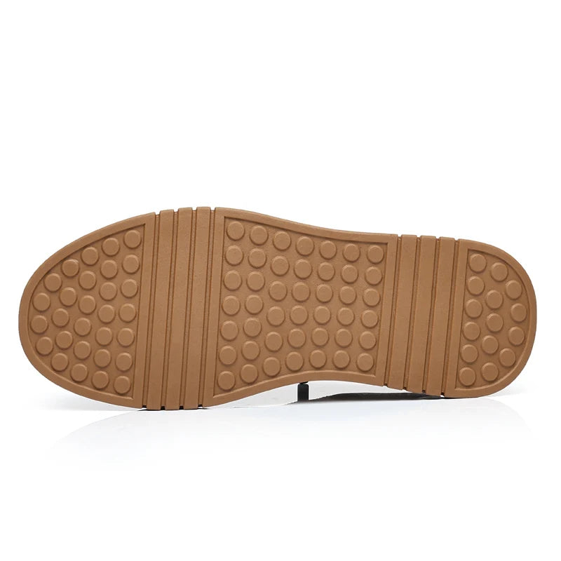 Brown shoe sole with tread pattern on a white background