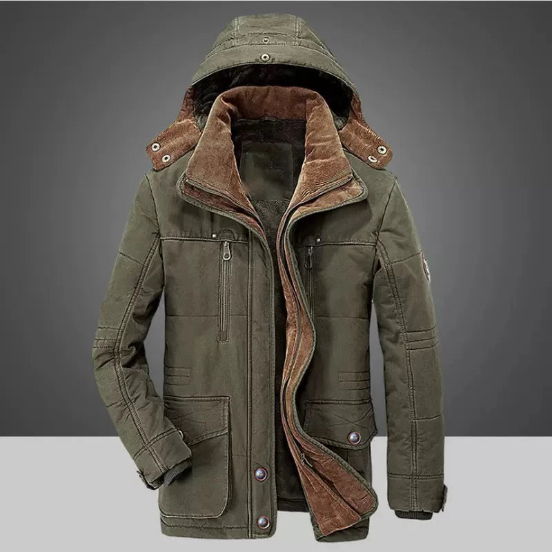 Green winter jacket with brown fur lining on a gray background