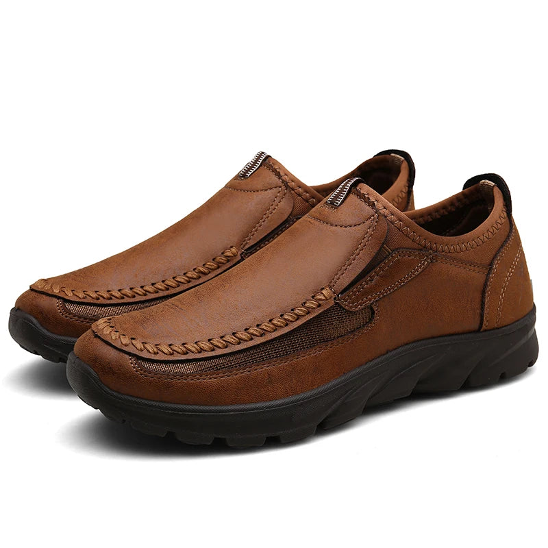Pair of brown leather shoes on a white background