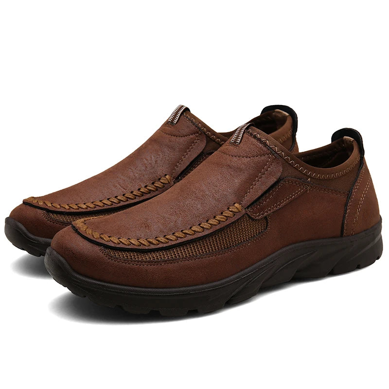 Pair of brown leather shoes on a white background