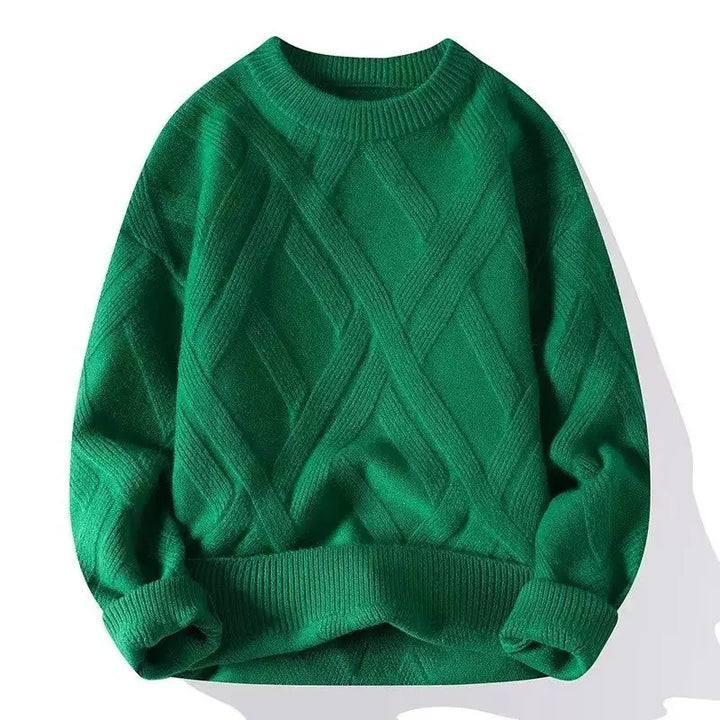 Green cable knit sweater on a white background