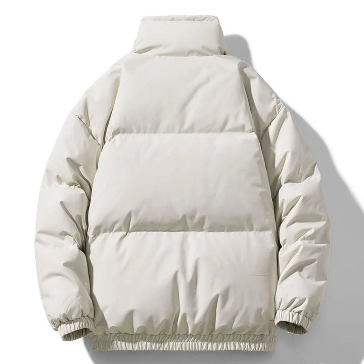Beige puffer jacket on a white background