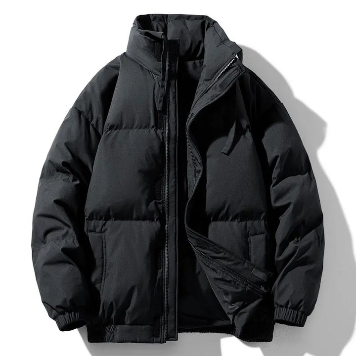 Black puffer jacket on a white background