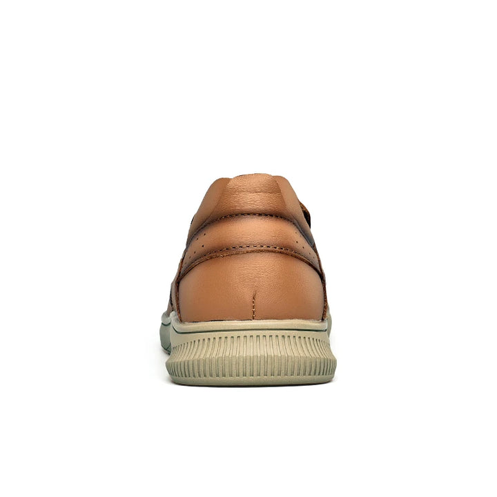 Brown leather shoe with a white sole on a white background