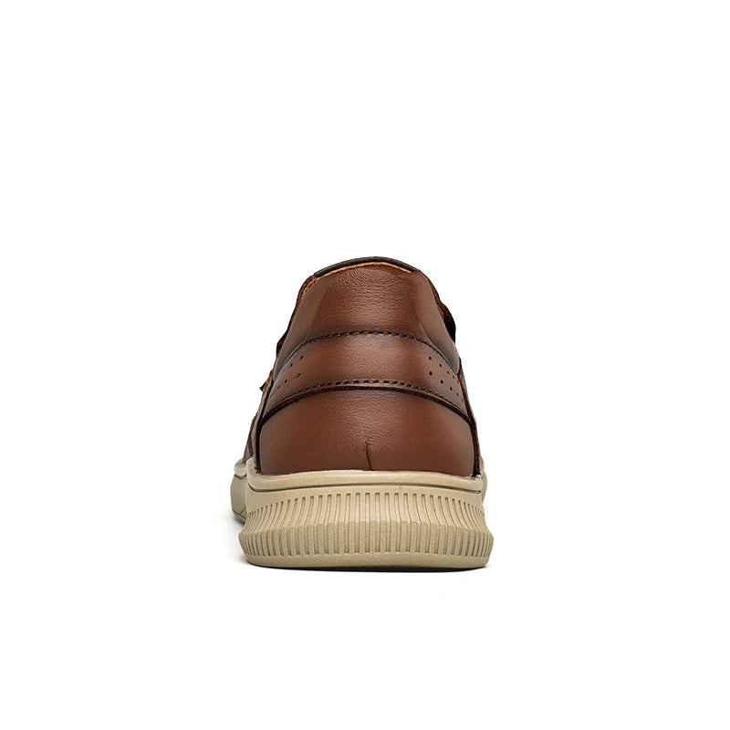 Brown leather shoe with beige sole on a white background
