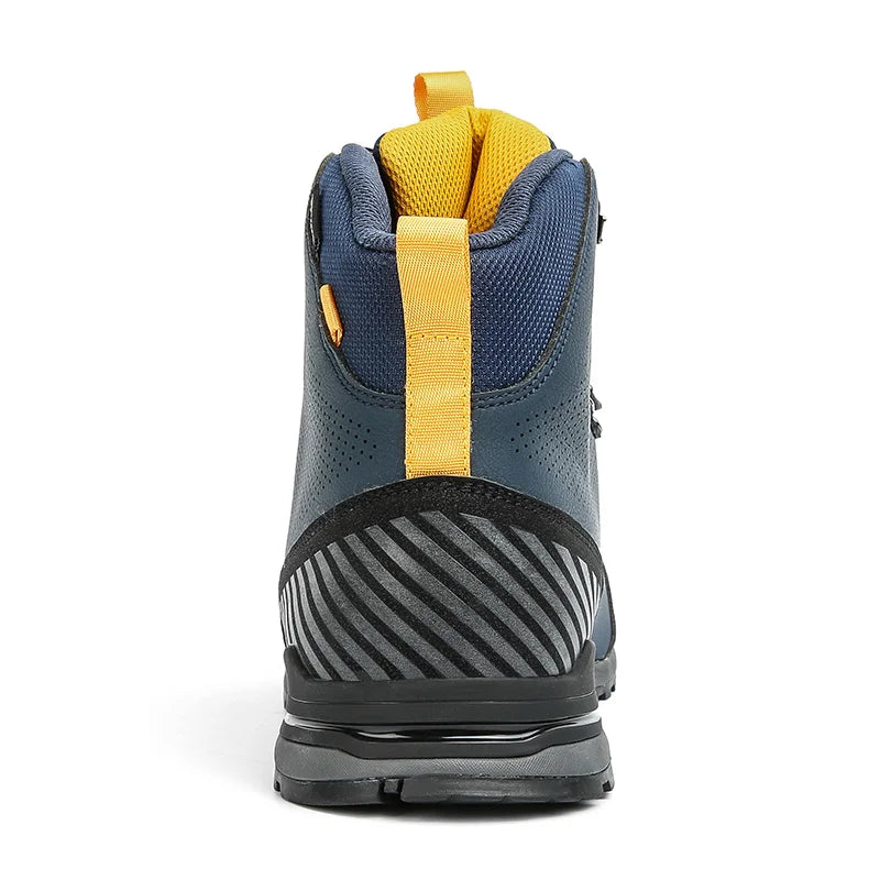 Close-up of a blue and yellow hiking boot sole on a white background