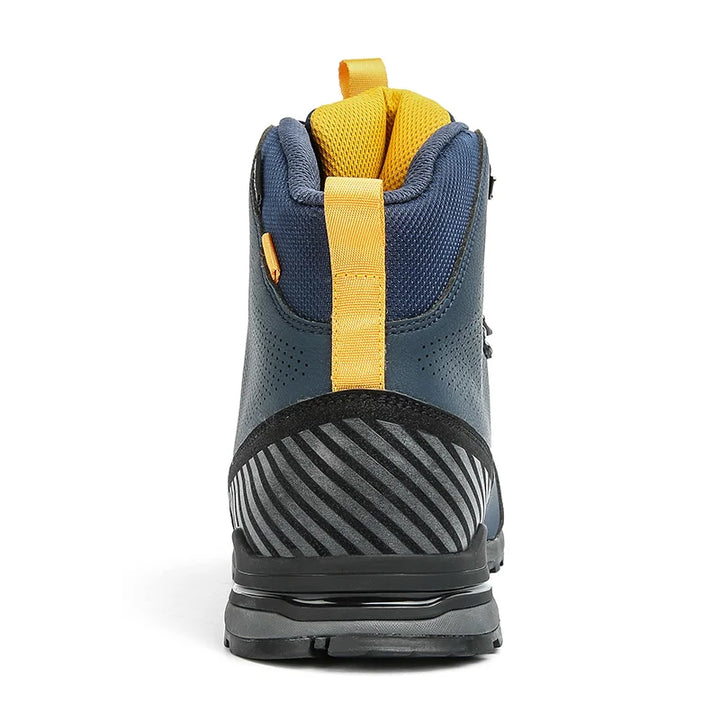 Close-up of a blue and yellow hiking boot sole on a white background