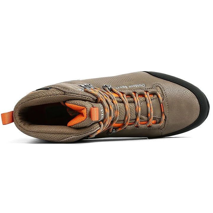 Brown hiking boot with orange laces on a white background