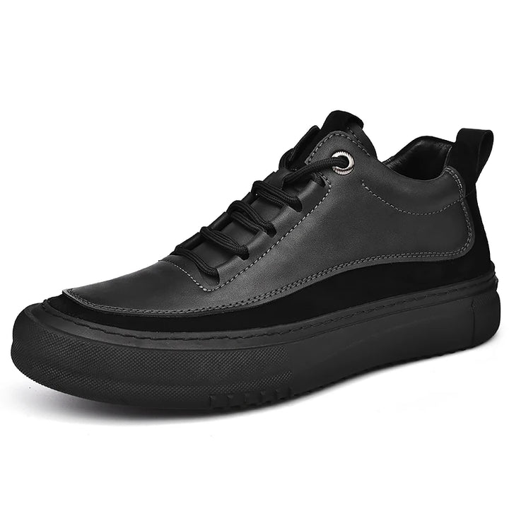 Black leather sneaker on a white background