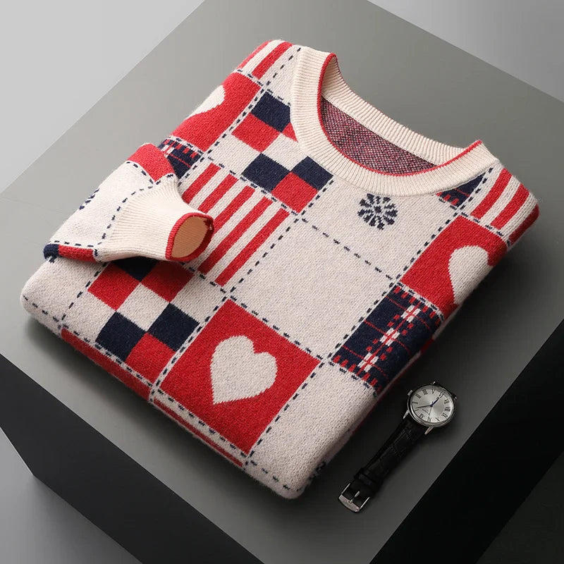 Folded patchwork sweater with red, white, and blue patterns on a gray surface.