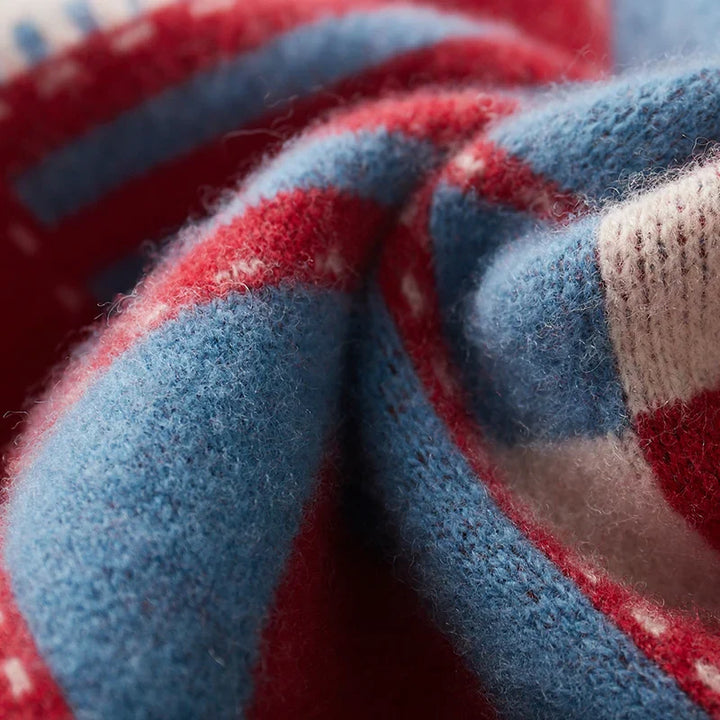 Close-up of red and blue striped fabric with a textured pattern