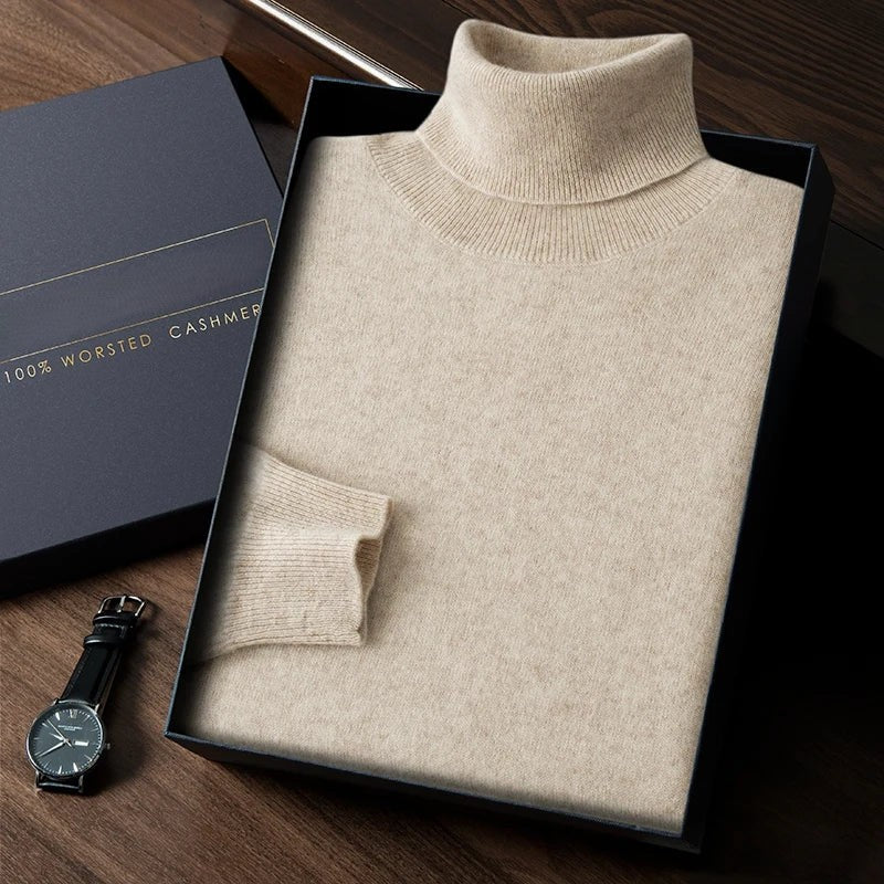 Beige turtleneck sweater in a box with a watch on a wooden surface