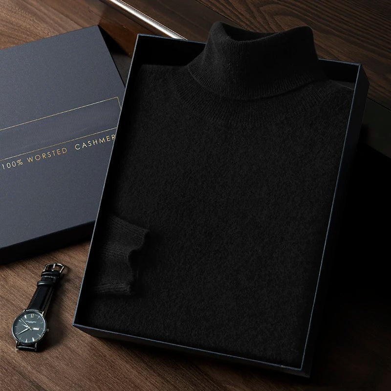Black turtleneck sweater in a box with a watch on a wooden surface