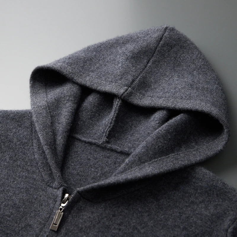Close-up of a gray hoodie with a zipper on a light gray background