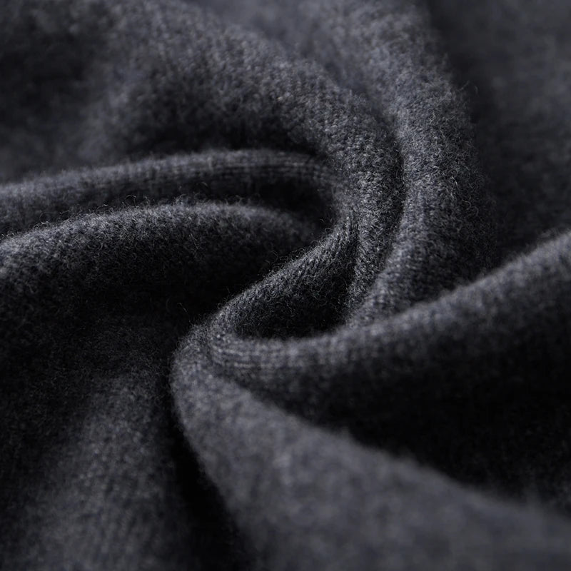 Close-up of dark gray fabric with a textured pattern