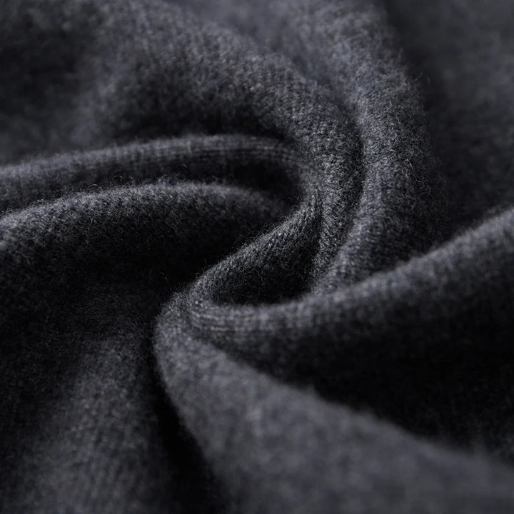 Close-up of dark gray fabric with a textured pattern