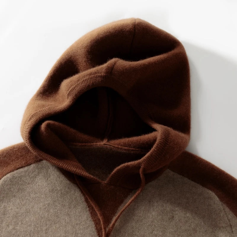 Close-up of a brown and gray garment with a hood on a white background