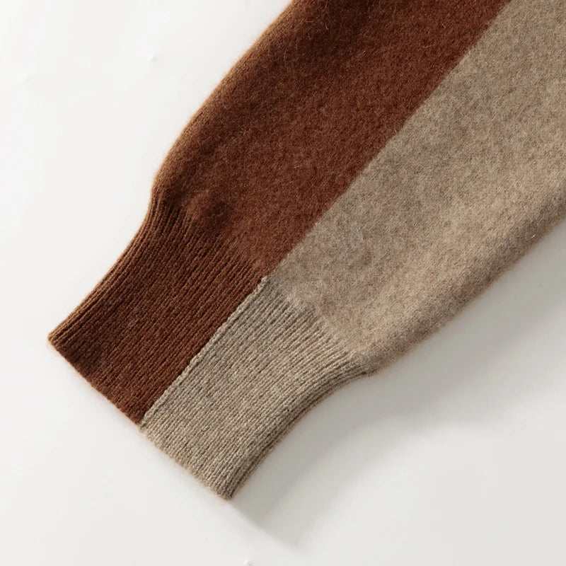 Close-up of a brown and beige sweater sleeve on a white background