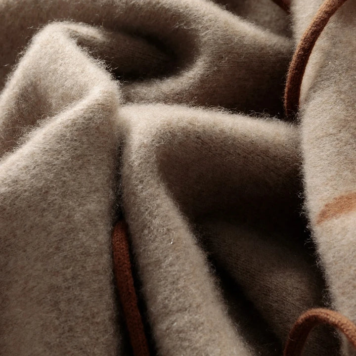 Close-up of brown fabric with leather trim