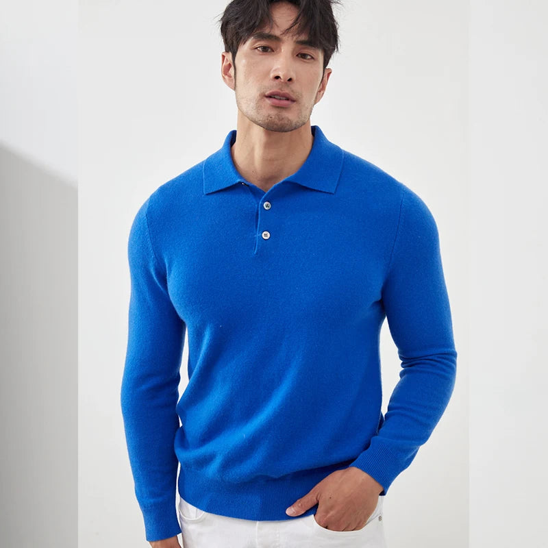Man wearing a blue long-sleeve polo shirt against a white background