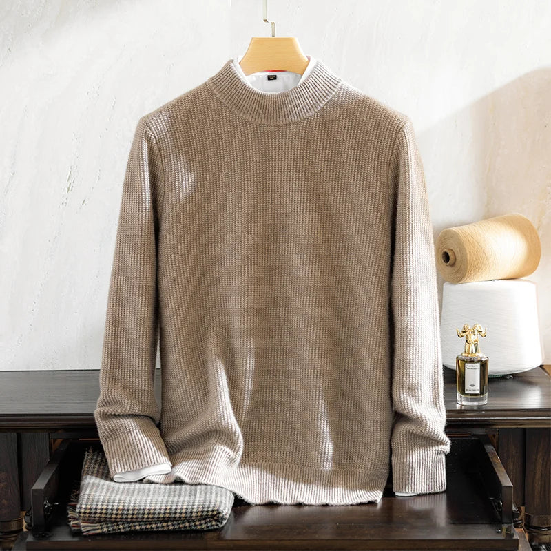Beige sweater on a hanger with a blurred background