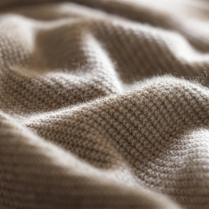 Close-up of beige knitted fabric texture