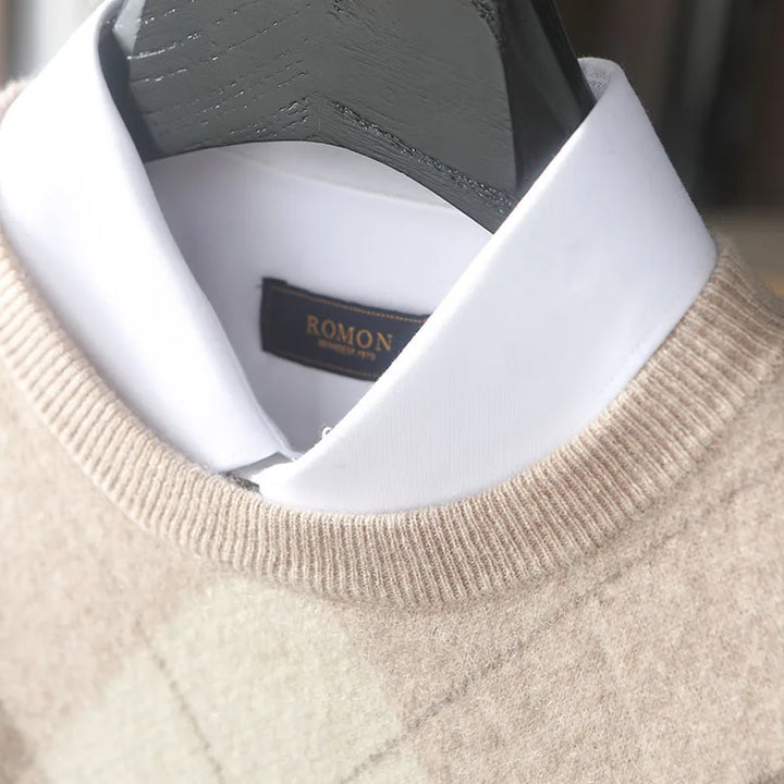 Close-up of a beige sweater with a white shirt collar and 'ROMON' label.