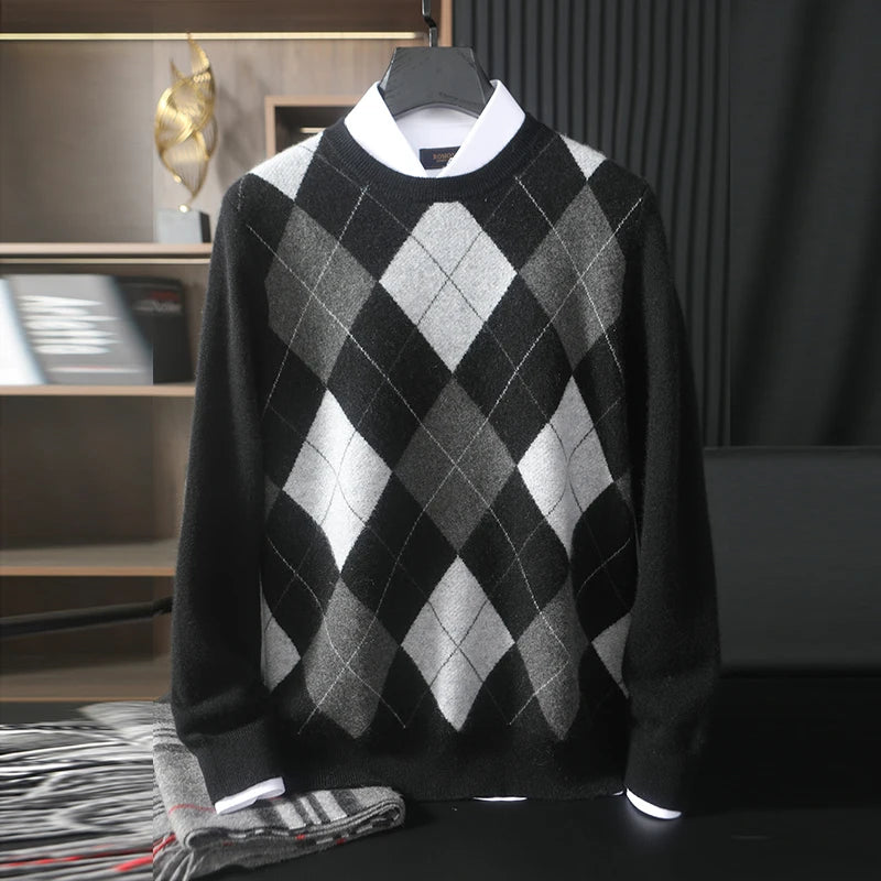 Black and gray argyle sweater on a hanger with a blurred background