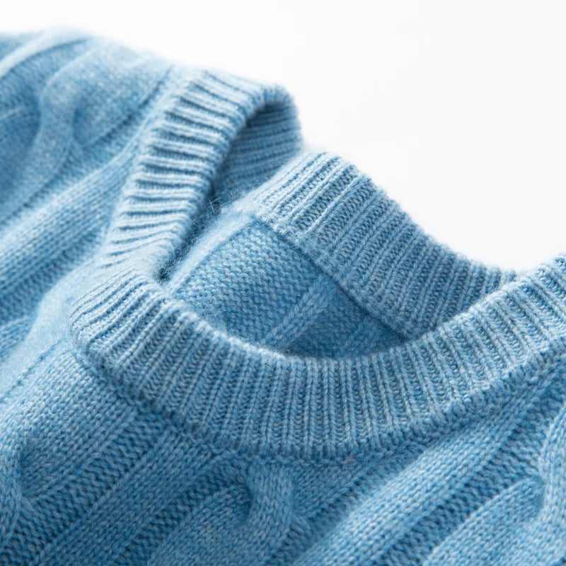Close-up of a blue knitted sweater on a white background