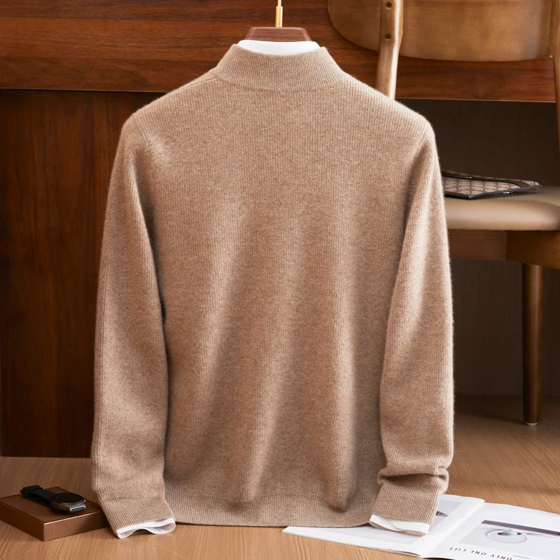 Beige sweater on a mannequin against a wooden background