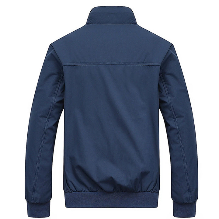 Blue jacket shown from the back on a white background