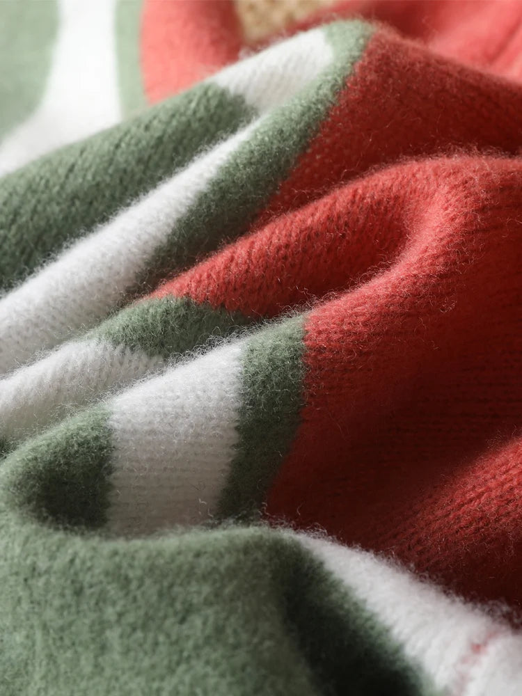 Close-up of red, green, and white fabric with a textured pattern.