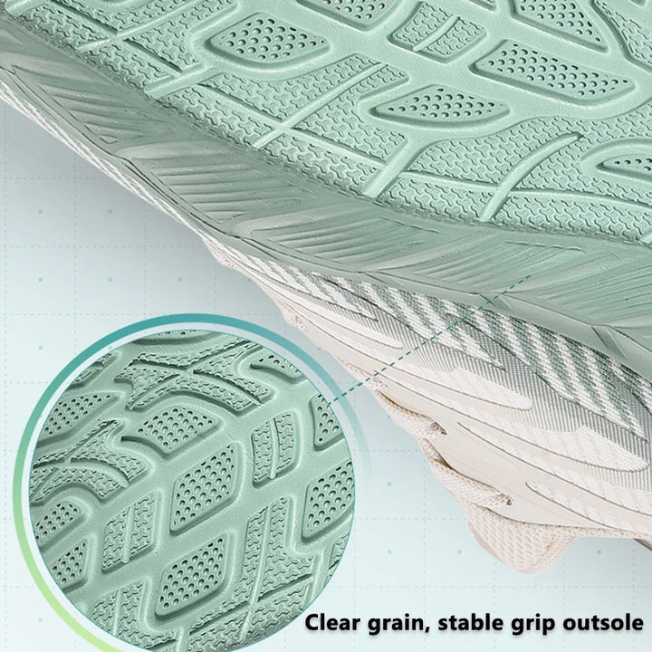 Close-up of a green shoe sole with clear grain and stable grip, on a white background.
