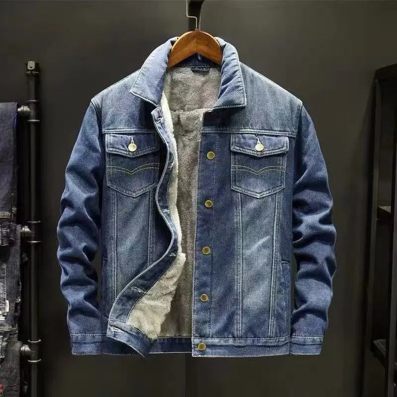 Denim jacket with shearling lining on a hanger against a dark background