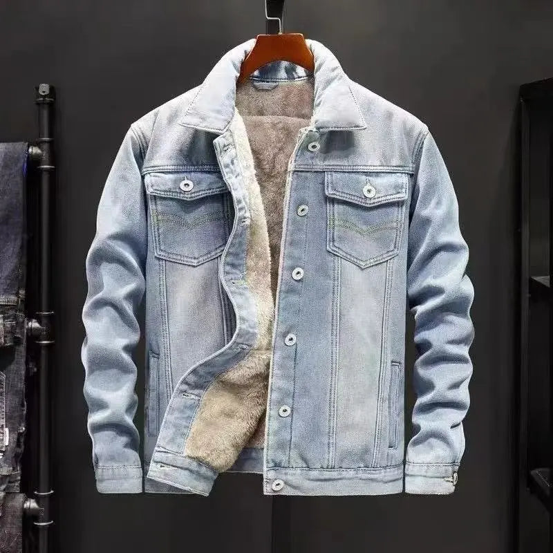 Denim jacket with shearling lining on a hanger against a dark background