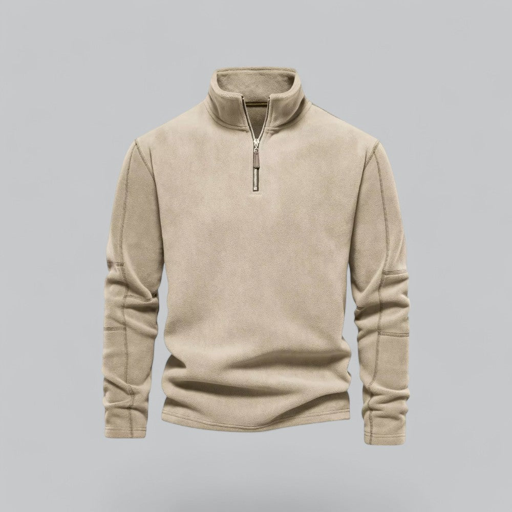 Beige fleece pullover with a zipper on a gray background