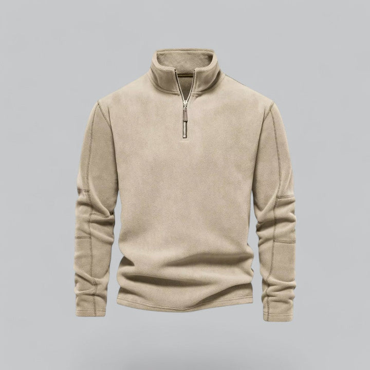 Beige fleece pullover with a zipper on a gray background