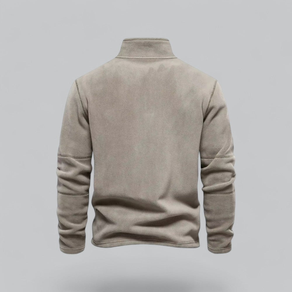 Beige fleece pullover on a gray background